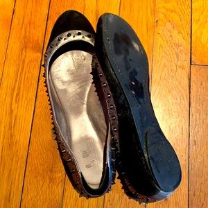 Belle suede flats with sliver leather trim and spikes.